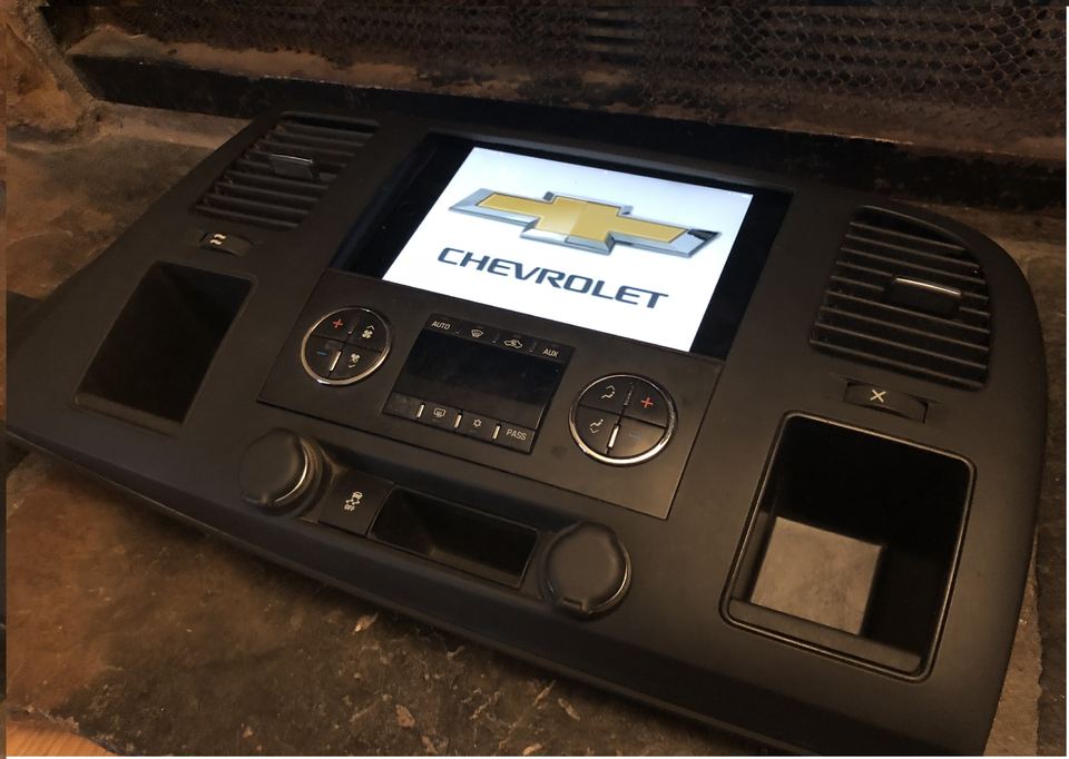 Chevrolet Silverado dash bezel with an integrated iPad mini 4 showing the Chevrolet logo